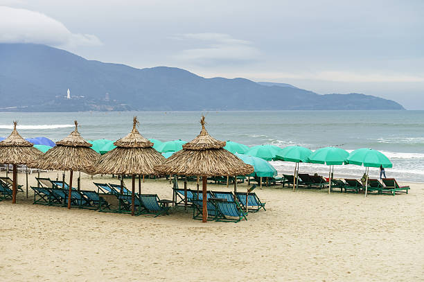 istock Shelters and sunbeds on China Beach in Da Nang 547017330