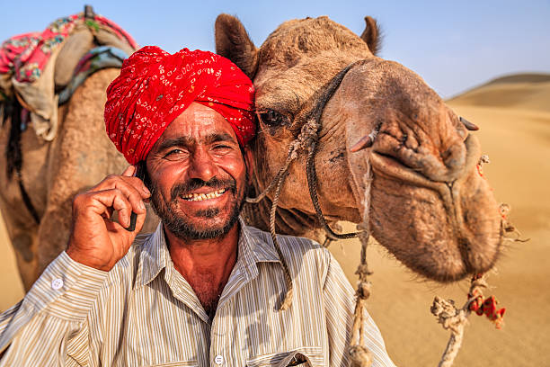 istock Indian man using a mobile, desert village, India 547017916