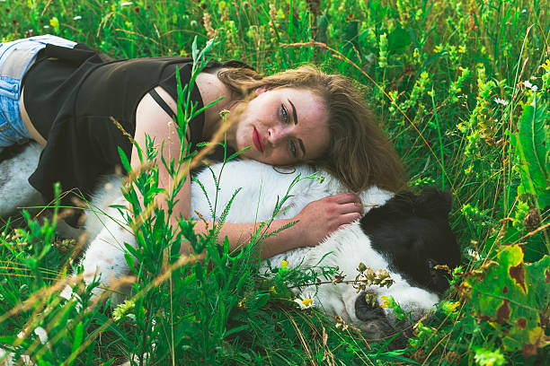 istock Young woman resting with Central Asian Shepherd dog 547018012