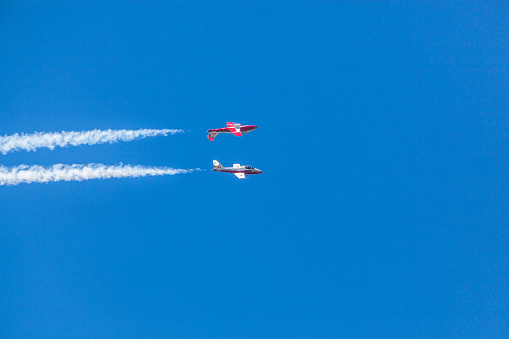Gatineau, Canada - June 30, 2016: The Wings over Gatineau Airshow is an airshow at the Gatineau Executive Airport. This image shows the Canadian Forces Snowbirds aerial demonstration team flying in the blue sky.