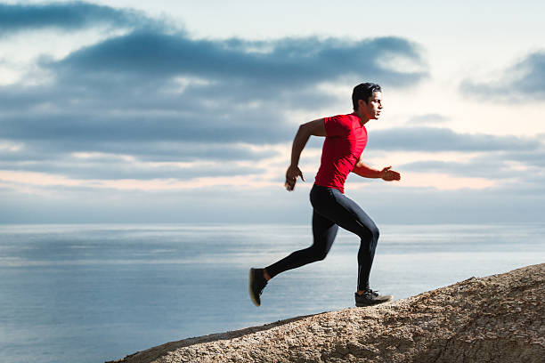 istock Hispanic Runner On The Bluffs Over The Ocean 547018550