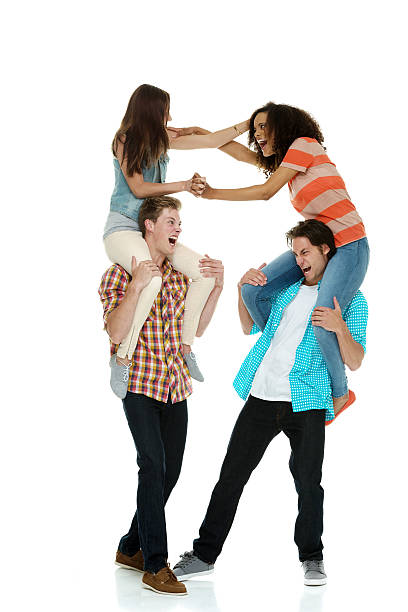 istock Two women fighting on men's shoulders 547019272