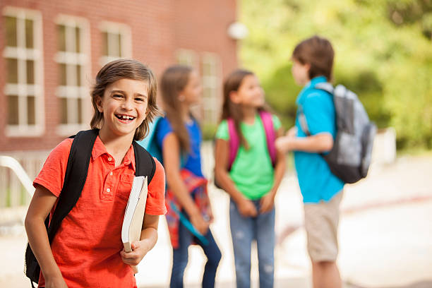istock Back to School:  Elementary-age children, friends on school campus. 547019448