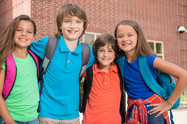 istock Back to School:  Elementary-age children, friends on school campus. 547021668