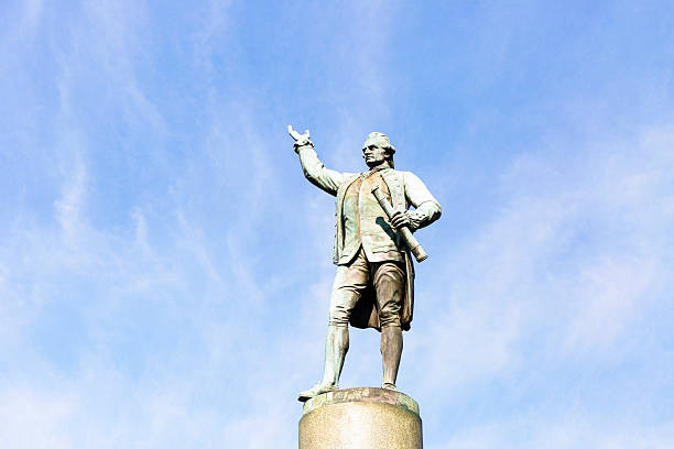 istock Statue of Captain James Cook against blue sky, copy space 547022054