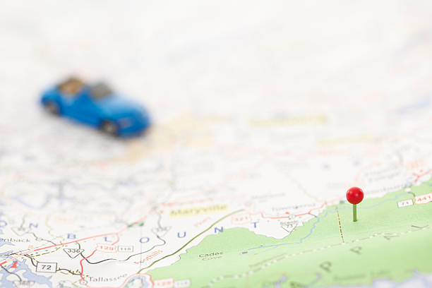 istock Thumbtack and Toy Car on Map 547024614