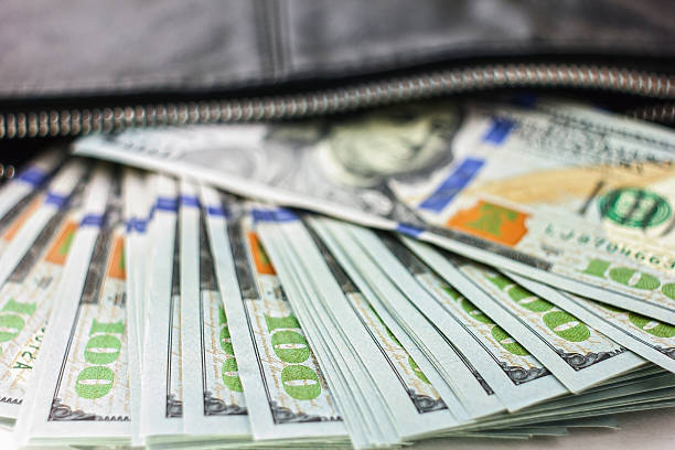 istock dollar notes in a wallet, hundred-dollar bills are in   bag, 547024664