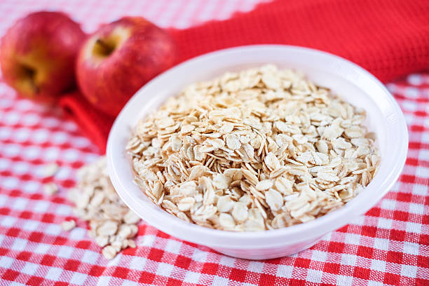 Dry rolled oat flakes oatmeal stock photo