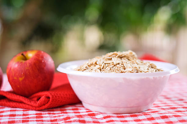 Dry rolled oat flakes oatmeal stock photo