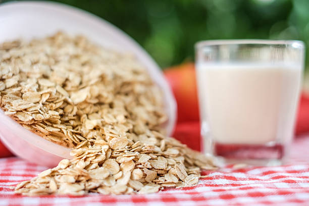 Dry rolled oat flakes oatmeal stock photo