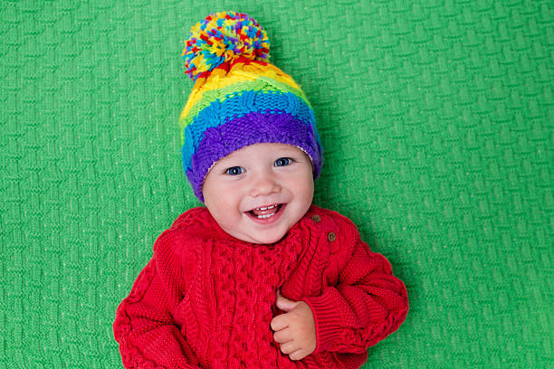 istock Little baby in warm knitted hat 547025758