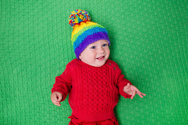 istock Cute little baby in warm knitted hat 547025948