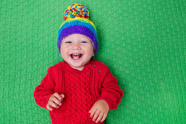 istock Happy little baby in warm knitted hat 547026292