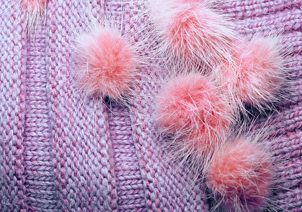 istock ribbed knit wool like texture with fur pompoms, textured knitted 547029900