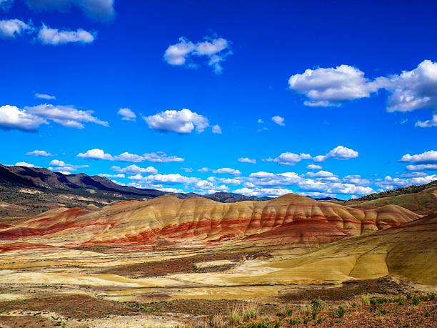 The Painted Hills National Monument has vibrant red hills in Eastern Oregon with fossil beds and historic significance.