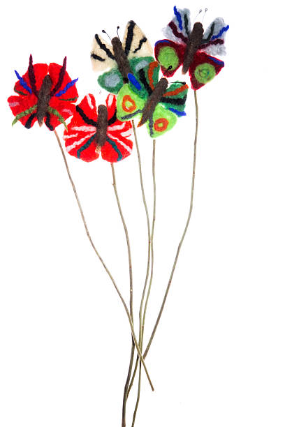 istock Butterflies of felted wool on the branches 547036578