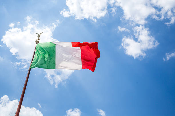 istock Waving Italian flag against blue sky. 547037676