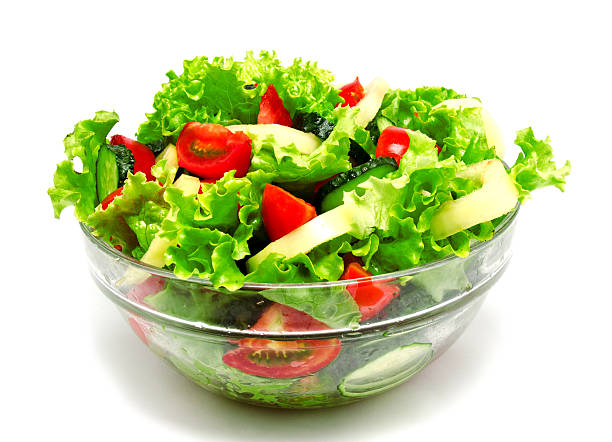 istock Fresh vegetable salad isolated on a white 547040226