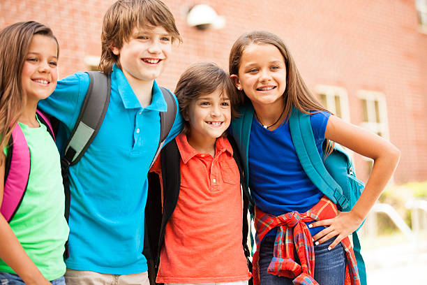 istock Back to School:  Elementary-age children, friends on school campus. 547040666