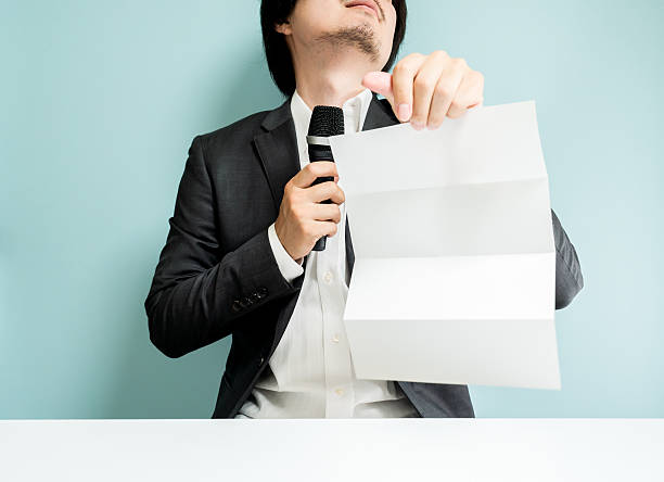 istock Asian man holding white paper 547041296