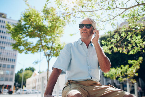 istock Mature man sitting outdoors in the city 547043248