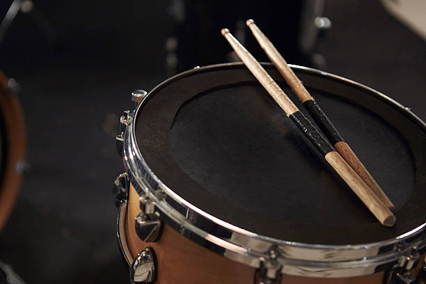 istock Close Up Of Sticks Resting On Snare Drum 547044078