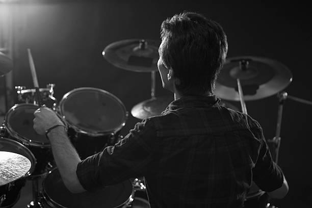 istock Black And White Shot Of Drummer Playing Drum Kit In 547044162