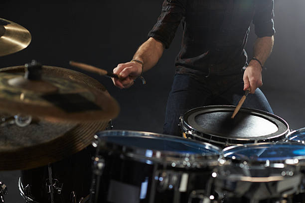 Close Up Of Drummer Playing Drum Kit In Studio Close Up Of Drummer Playing Drum Kit In Studio snare drum photos stock pictures, royalty-free photos & images