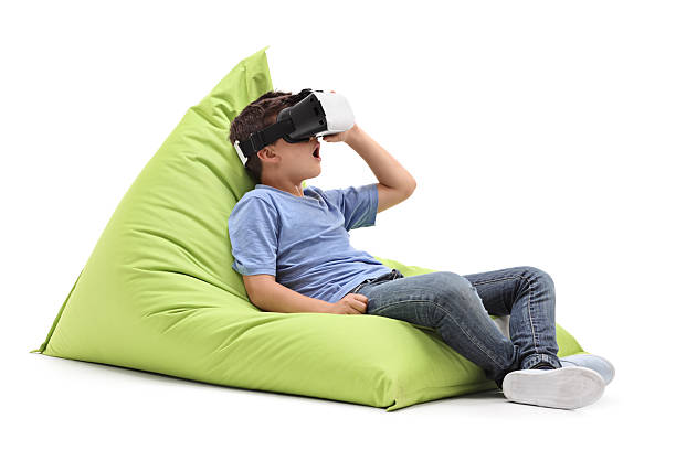 Joyful kid looking in a VR goggles