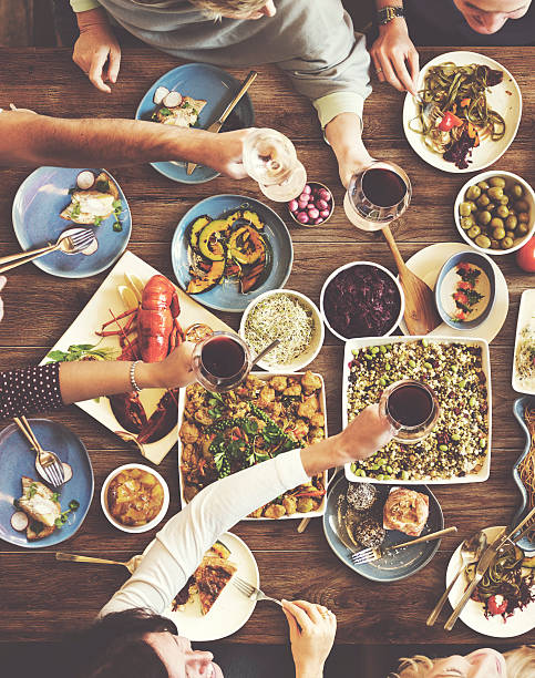 istock Friends Happiness Enjoying Dinning Eating Concept 547045984