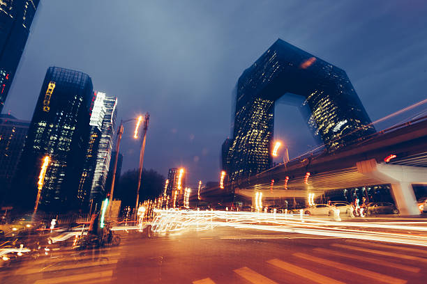 Stock Photo - Beijing, China - October 25, 2015: Abstract blury image of a night view of CCTV Headquarters Beijing China at the Central Business District in Beijing, China.
