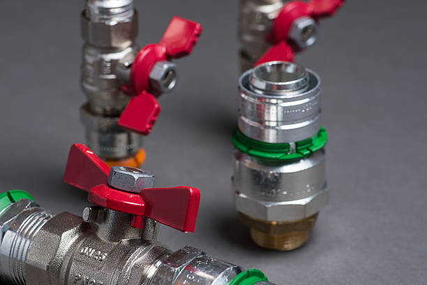 istock Water valves with fittings on grey 547048100