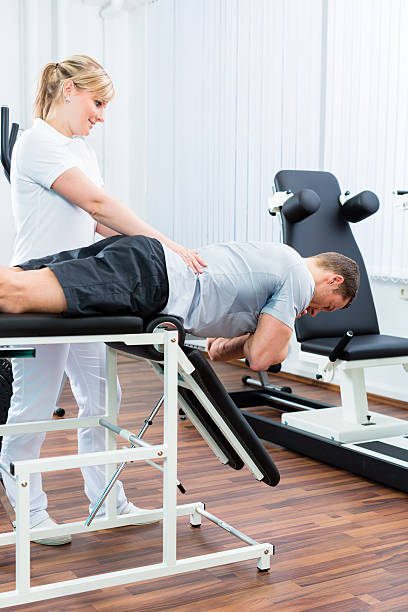 istock Physiotherapist or sport doctor with patient 547048966