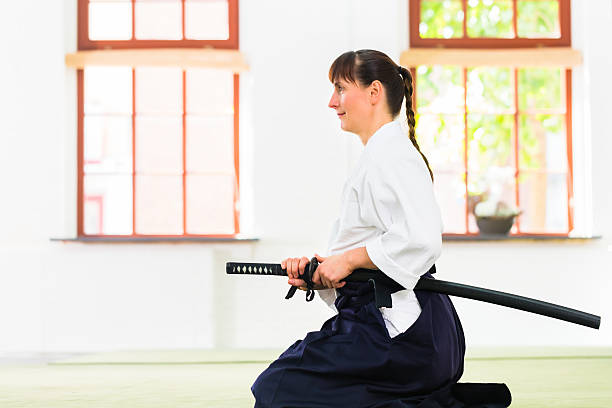 istock Woman at Aikido martial arts with  sword 547049990