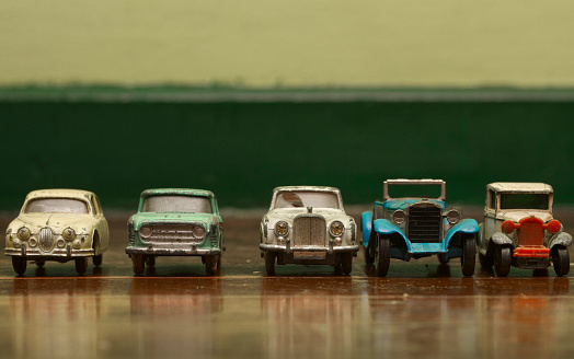 old tin toy car on old wooden floor