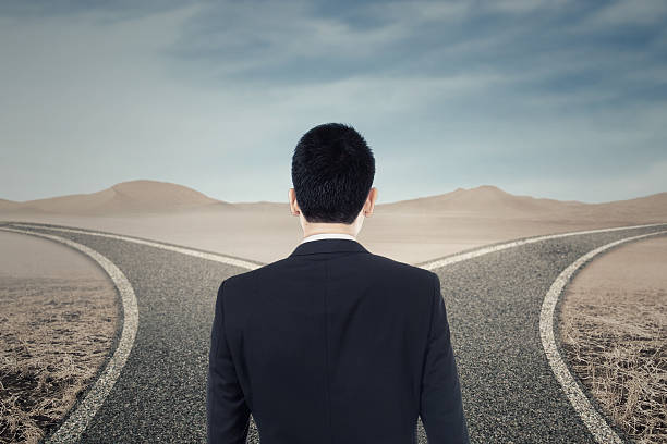 istock Businessperson looking at two highway 547052802