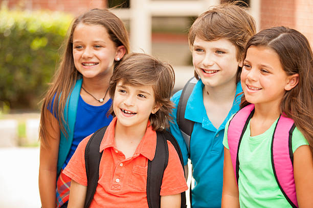 istock Back to School:  Elementary-age children, friends on school campus. 547056770