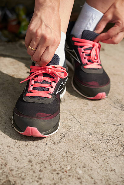 istock corrects sneakers on his feet 547123544
