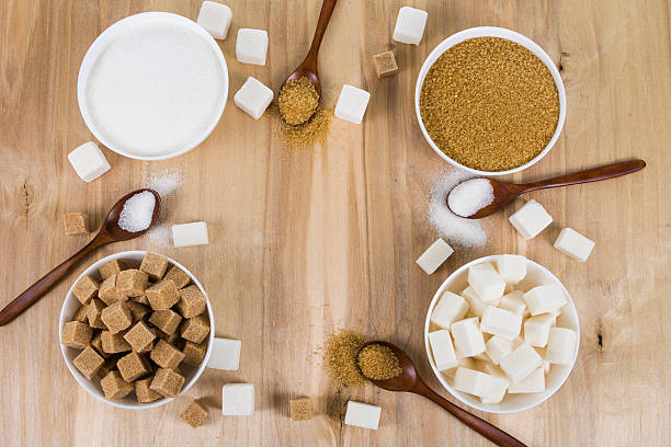 istock Cane and white sugar in a white bowls 547126268