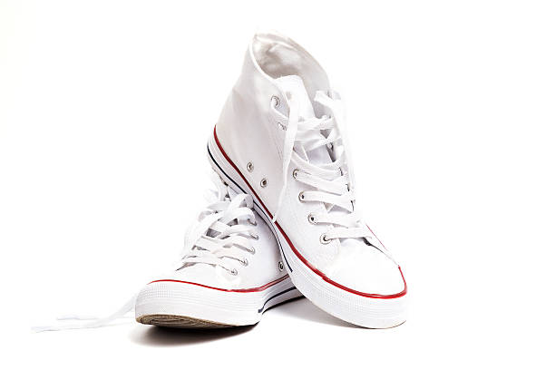 sneakers Pair of new white sneakers isolated on white background. canvas shoe photos stock pictures, royalty-free photos & images