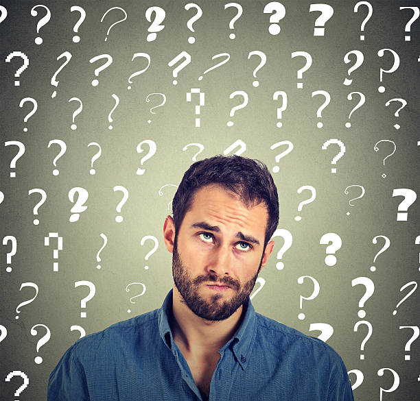 istock funny confused man thinking looking up has many questions 547129418