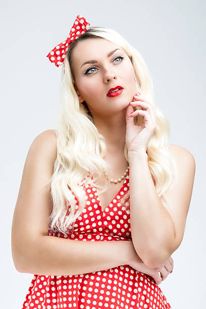 istock Young Caucasian Blond Female Posing in Pinup Style 547130302