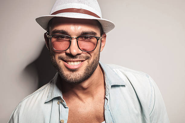 istock handsome casual man wearing a white hat and sunglasses. 547131846