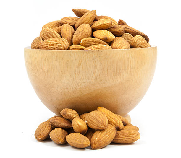 istock bowl wood of almonds isolated 547133154