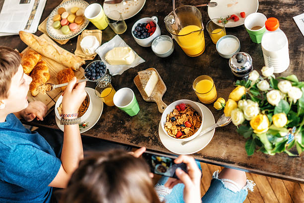 istock kids having breakfast together at weekend 547133628
