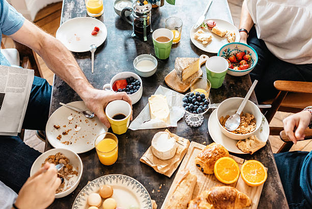family having breakfast together inn holidays