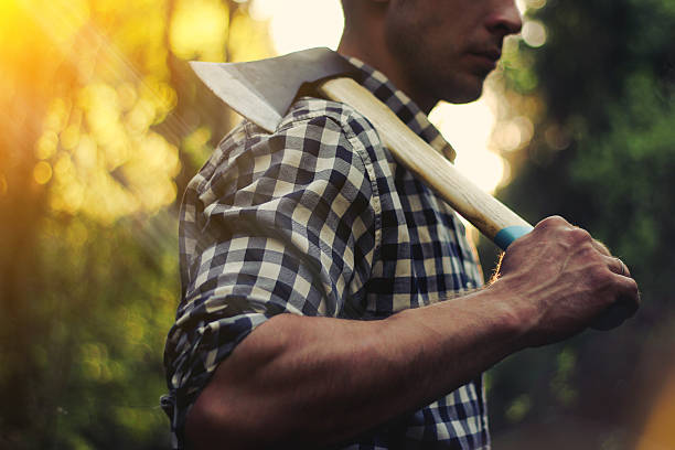 istock Strong lumberjack in the woods with an ax 547134502