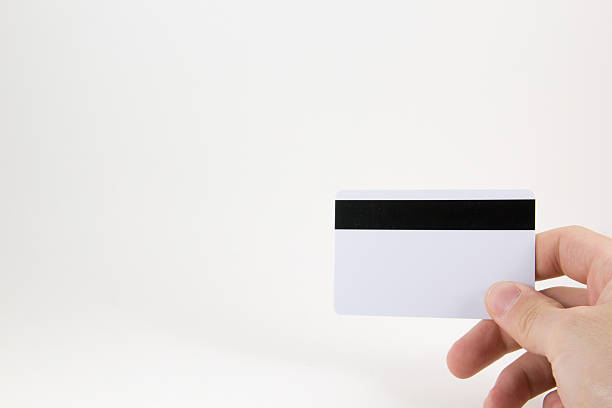 istock Hand with a credit card on a white background 547134906