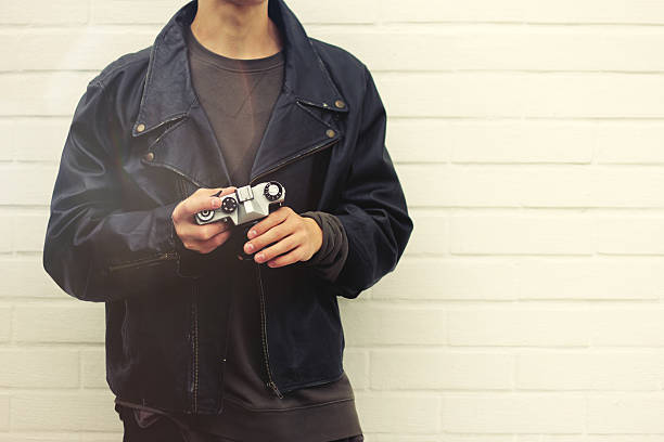 istock photographer with vintage camera on white background 547134928