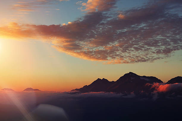 istock Mountain peaks in the clouds, sunset, Caucasus ridge 547135806
